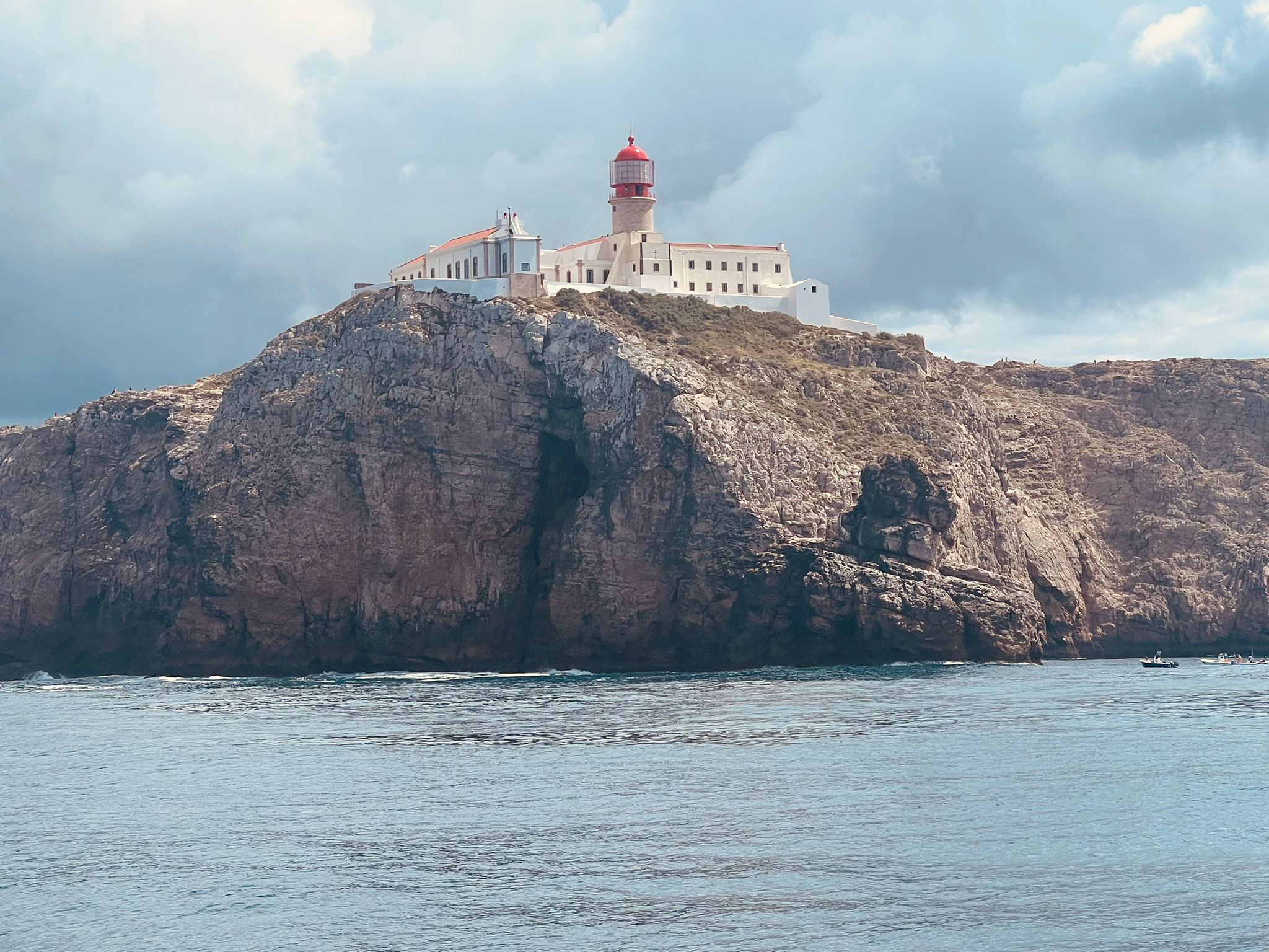 The lighthouse and cliffs at Cape St Vincent viewed from the sea