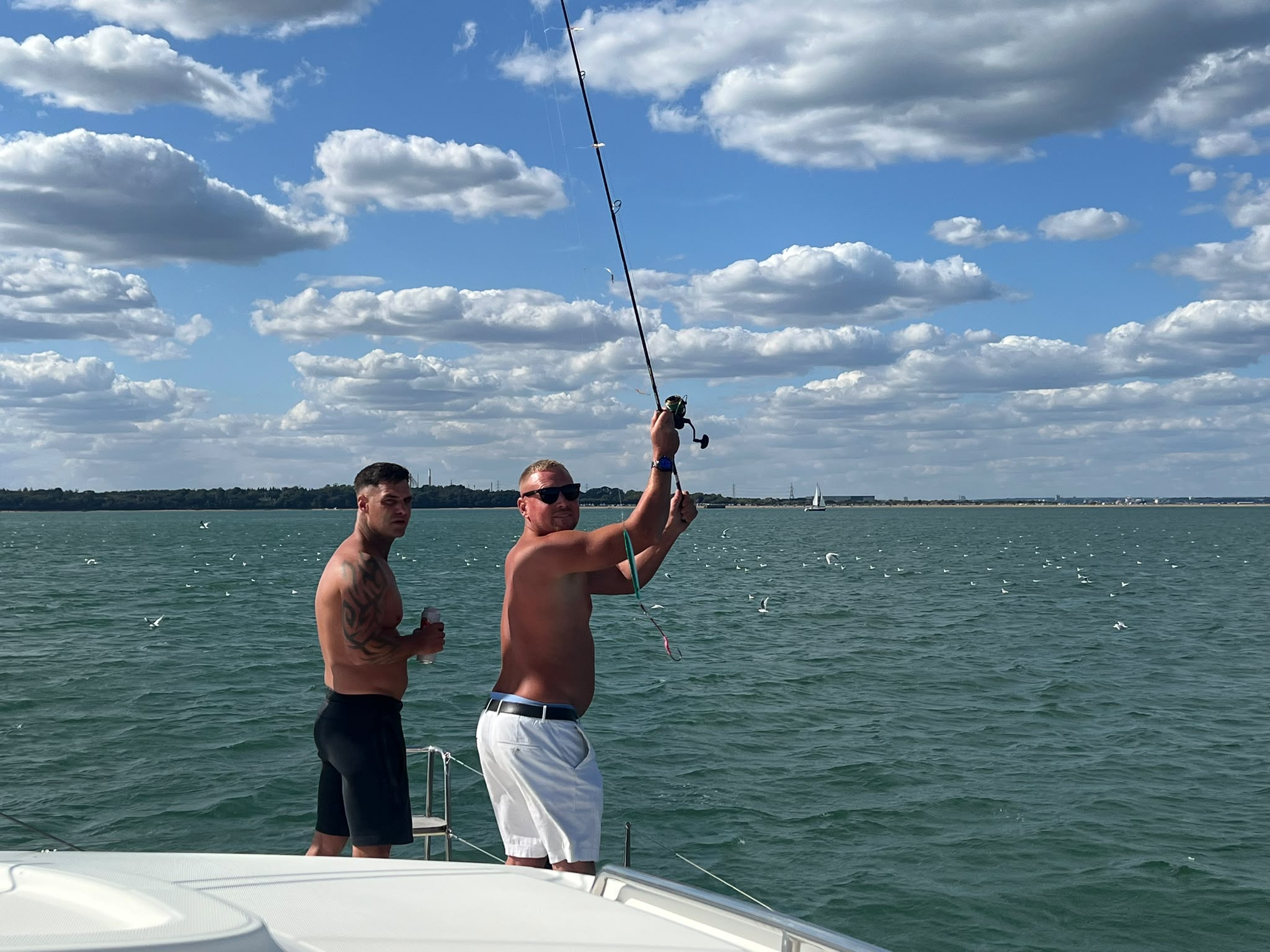 Guests trying fishing aboard RaRa