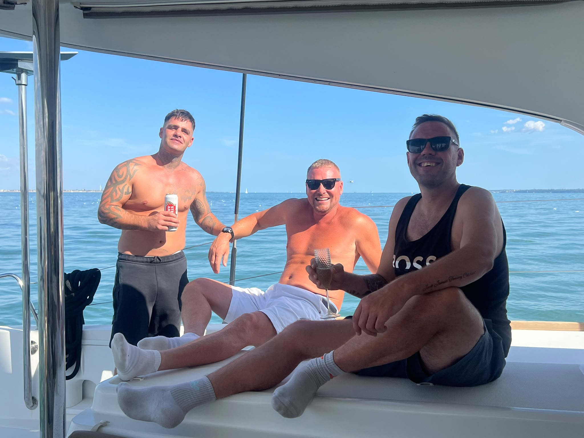 Friends raising a glass aboard RaRa