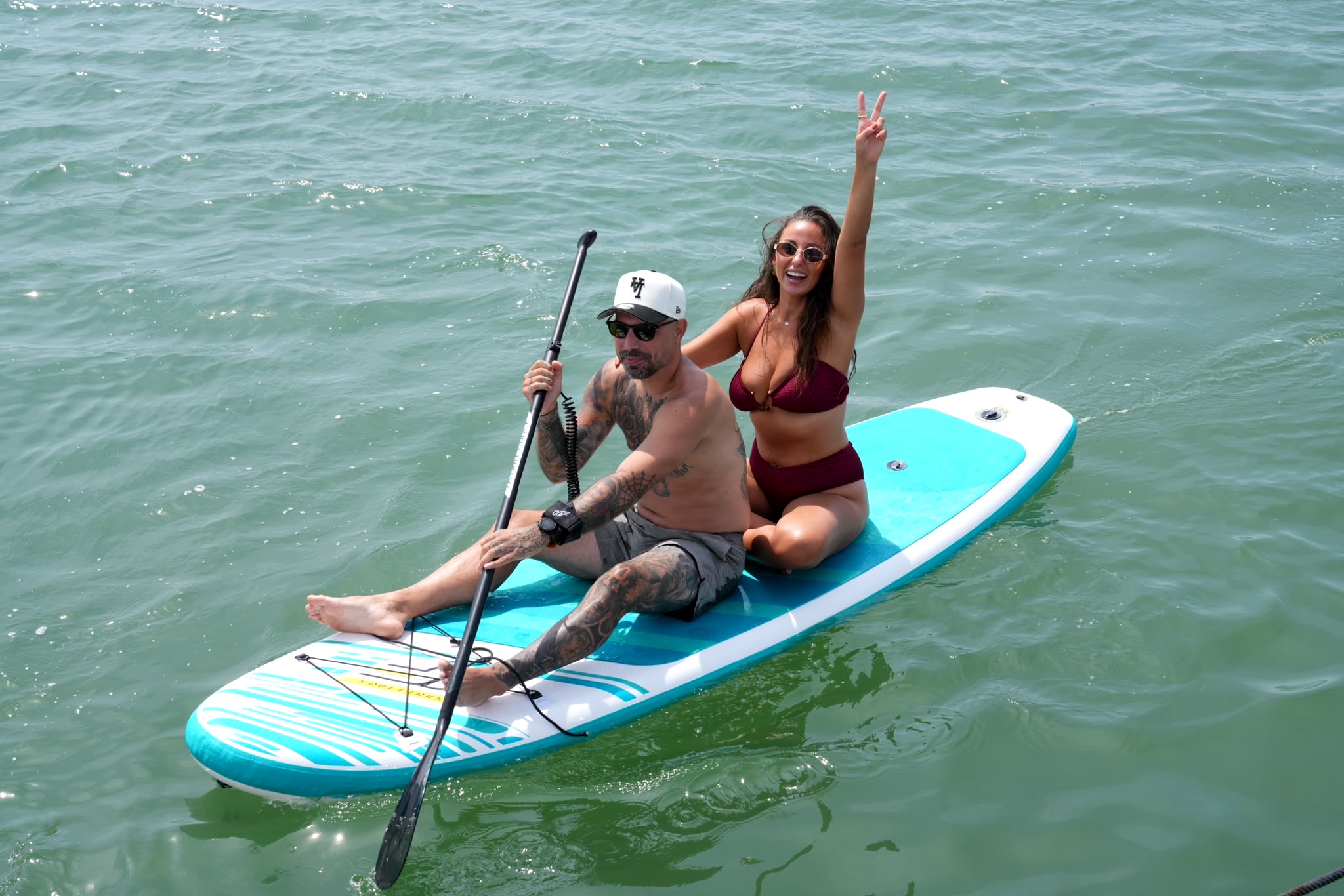 Couple sharing a paddleboard