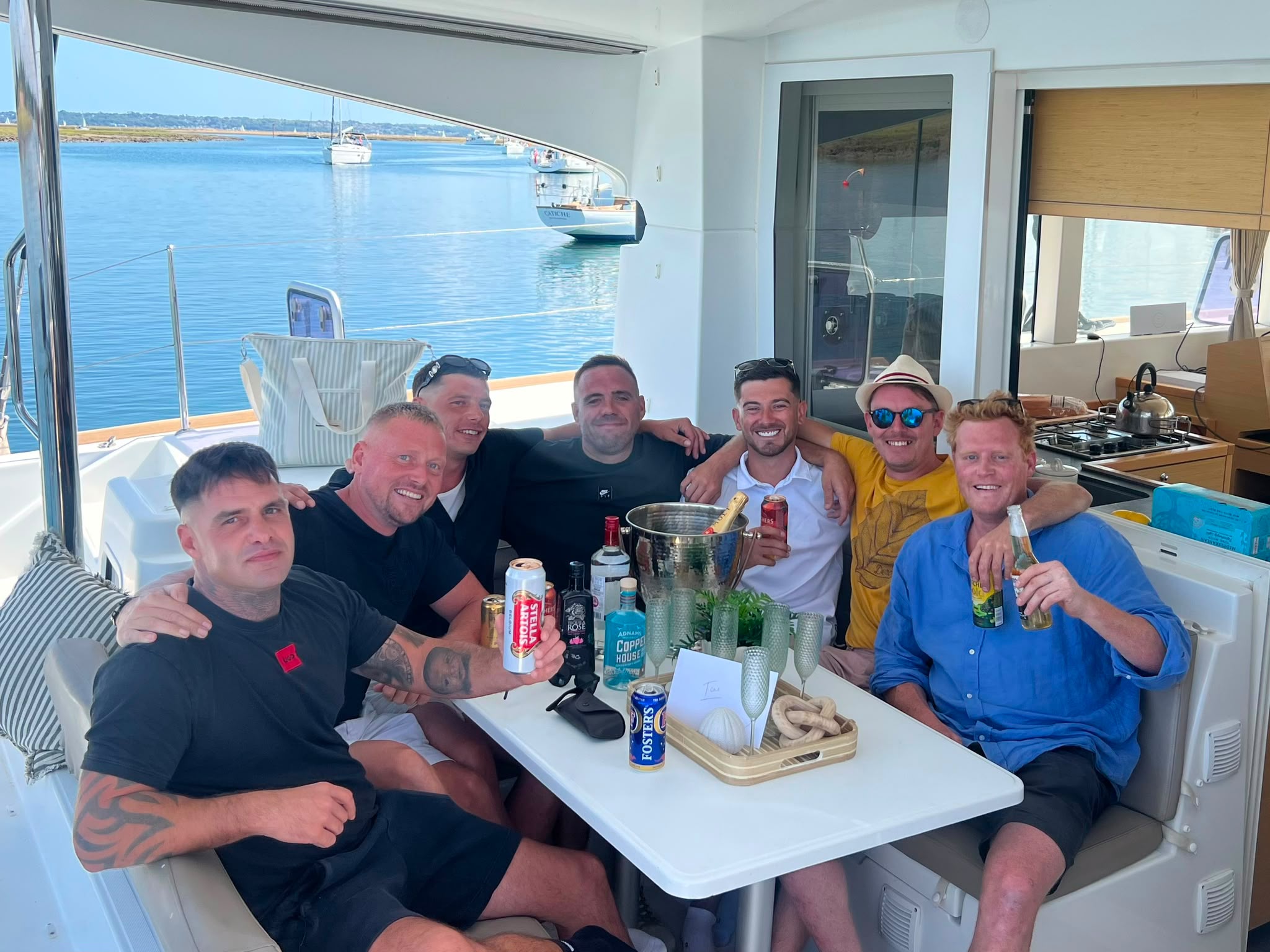 Friends celebrating around RaRa’s cockpit table