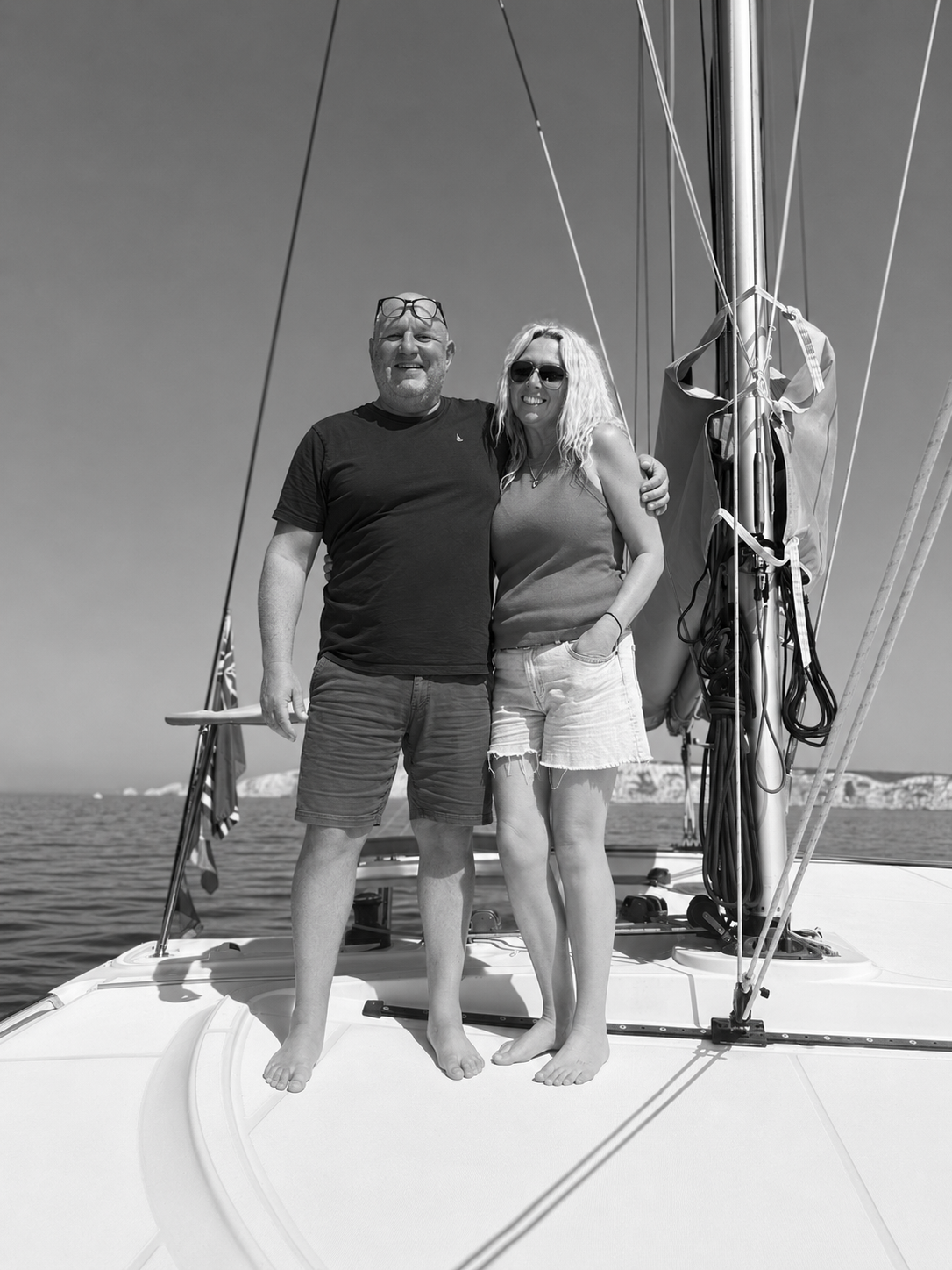 Dale and Rachel Toms standing together on RaRa’s foredeck